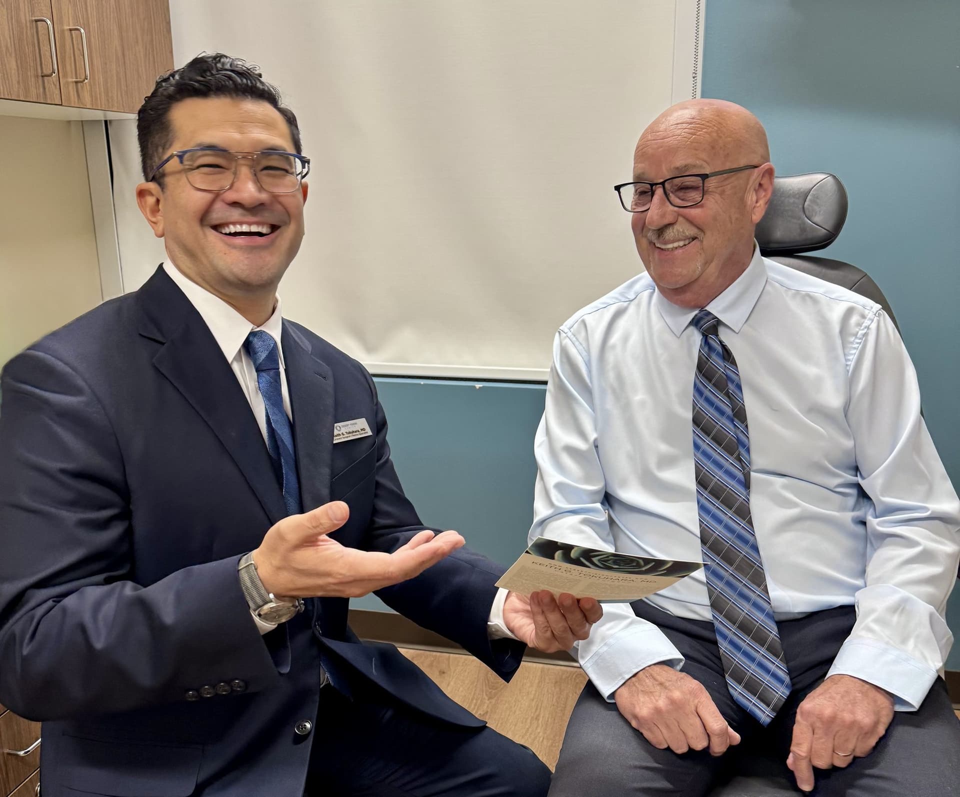 Dr. Tokuhara in a one-on-one consultation with a patient at Desert Vision Center