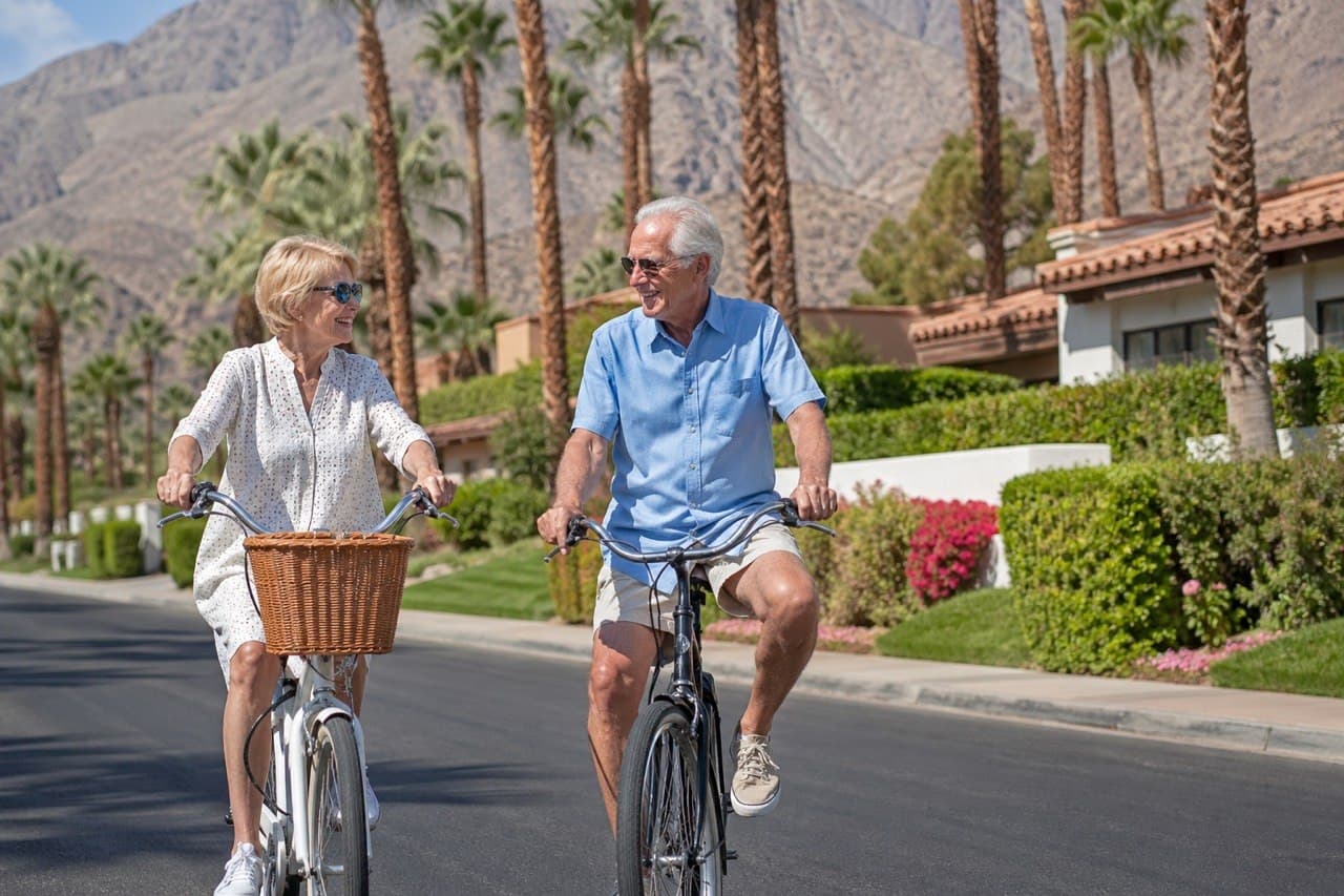 Couple cycling together on a scenic desert path in Palm Desert