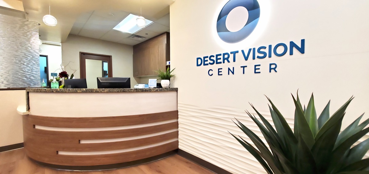 Desert Vision Center front desk and reception area with DVC logo