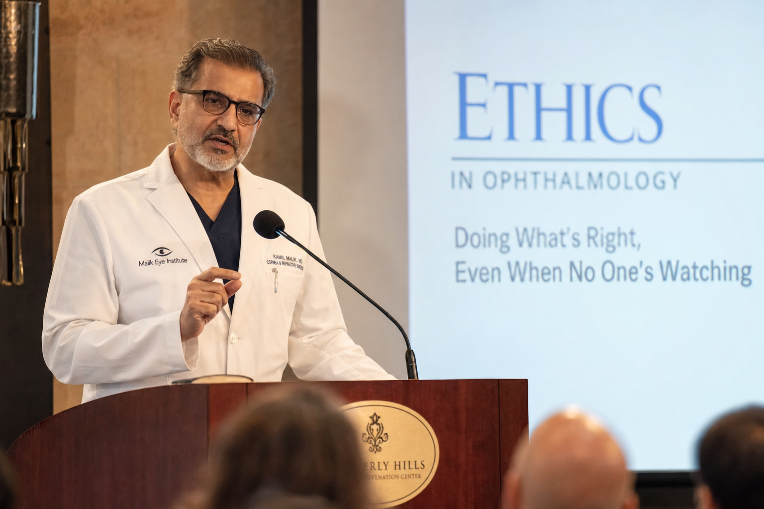 Physician speaking at an ethics in eyecare seminar